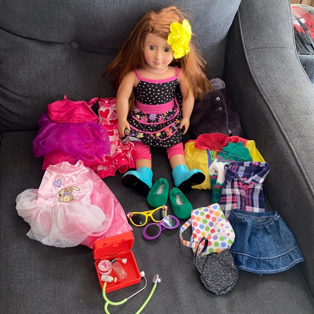 Gently used 18 inch doll with 7 outfits and accessories